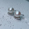 Women's Minimalist Sterling Silver Earrings With Natural And Breeding Freshwater Pearls In Oblate And Flat Round Shapes