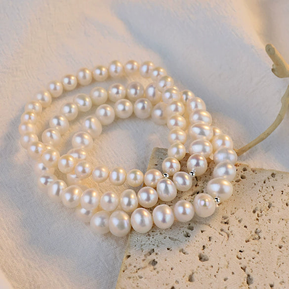 Women's Natural Freshwater Pearl Nearly Round Elastic Bracelet With Silverplated Beads And Highend Design