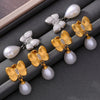 Women's Niche Style Bow Geometric Imitation Pearl Earrings 316L Stainless Steel 18K Gold Plated