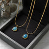 Women's Oval Aquamarine Pendant Necklace In Titanium Steel With Snake Bone Chain And Gold Plated Geometric Clavicle Chain Design