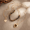 Women's Retro Amber Tiger's Eye Beaded Necklace With Plated Alloy Heart Pendant And Layered Geometric Design