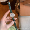 Women's Retro Dark Green Roman Starry Alloy Case Ordinary Glass Mirror Quartz Watch With Round Dial