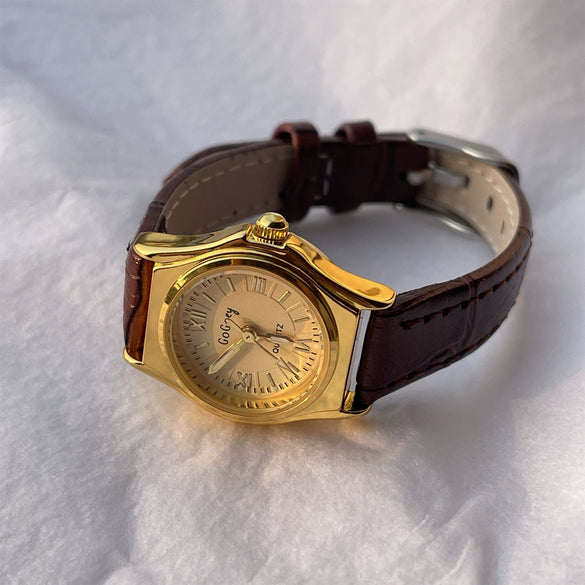 Women's Retro Leisure Metal Case Genuine Leather Strap Round Dial Quartz Watch