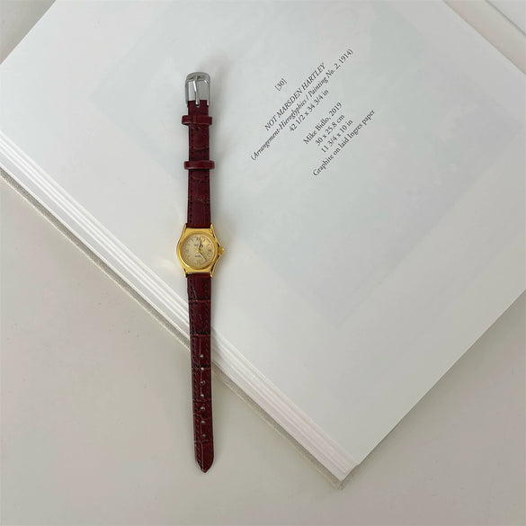Women's Retro Leisure Metal Case Genuine Leather Strap Round Dial Quartz Watch