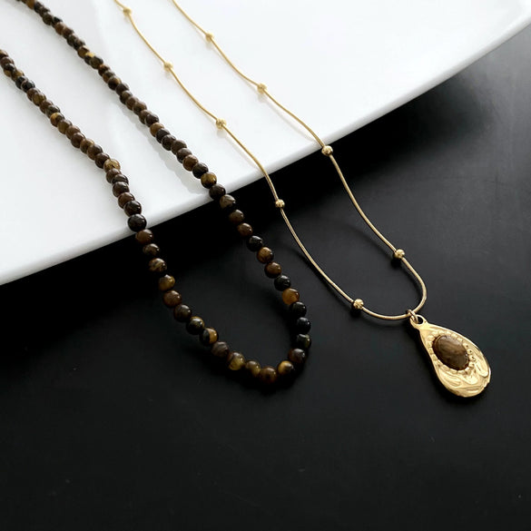 Women's Retro Light Luxury Titanium Steel Tiger Eye Necklace With Geometric Pattern And Electroplating Treatment And Pearl Chain