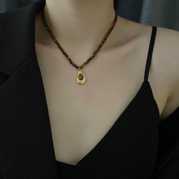 Women's Retro Light Luxury Titanium Steel Tiger Eye Necklace With Geometric Pattern And Electroplating Treatment And Pearl Chain