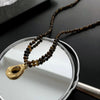 Women's Retro Light Luxury Titanium Steel Tiger Eye Necklace With Geometric Pattern And Electroplating Treatment And Pearl Chain