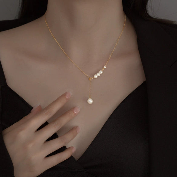 Women's Silver Geometric Imitation Pearl Pendant Necklace With Tassel Detail Cross Chain And Electroplated Light Luxury Design