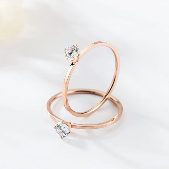 Women's Simple Geometric Titanium Steel Single Stone Ring With Four Claw Setting And Rose Gold Electroplated Finish