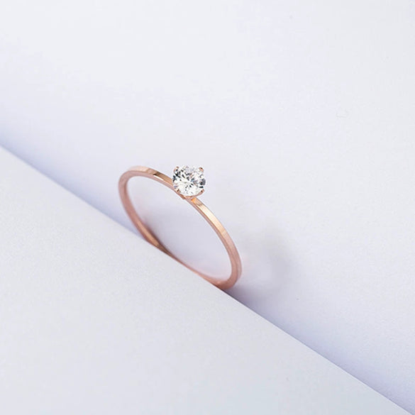 Women's Simple Geometric Titanium Steel Single Stone Ring With Four Claw Setting And Rose Gold Electroplated Finish