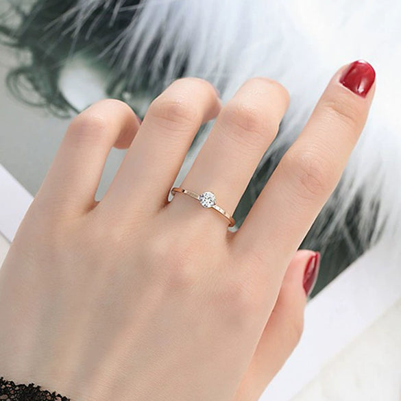 Women's Simple Geometric Titanium Steel Single Stone Ring With Four Claw Setting And Rose Gold Electroplated Finish
