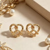 Women's Simple Heart Shaped Knot Earrings In Electroplated Alloy With Steel Ear Needles Fashion Bread Knot Design