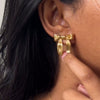Women's Stainless Steel Bow Pattern Electroplated Titanium Steel Earrings With Golden Hammer Pattern Fashionable And Simple