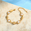 Women's Stainless Steel Bracelet With 18K Gold Vacuum Plating Pearl And Rhinestone Accents And Heart Shaped Geometric Design
