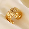 Women's Stainless Steel Geometric Wide Face Hammer Pattern Open Ring With Real Gold Plating And Flower Design