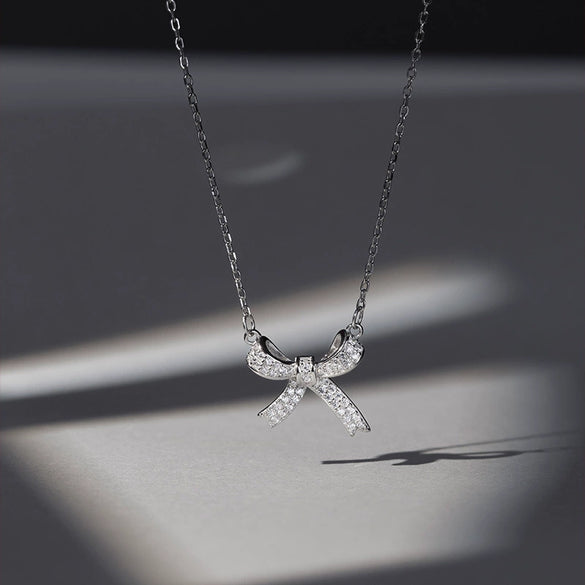 Women's Sterling Silver Bow Pendant Necklace With Electroplated Finish And Cross Chain Elegant Fashion Jewelry