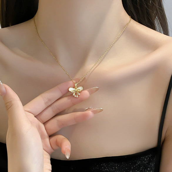 Women's Titanium Steel And Copper Geometric Bow Pendant Necklace With Real Gold Electroplated And Diamonds
