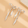 Women's Zinc Alloy Geometric Pleated Bowknot Tassel Earrings With Environmentally Friendly Electroplated Finish And Statement Design